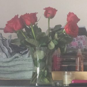 IMG-20150214-WA0002.jpeg photo of a vase filled with red roses